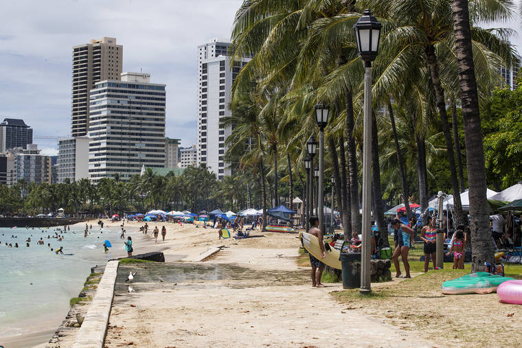 CINDY ELLEN RUSSELL / CRUSSELL@STARADVERTISER.COM
                                Tents were pitched with families and friends enjoying the Fourth of July along the shoreline of Waikiki today.