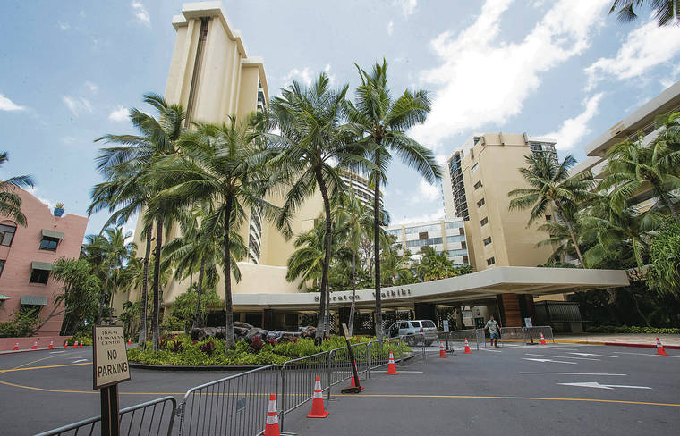 CINDY ELLEN RUSSELL / CRUSSELL@STARADVERTISER.COM
                                The entrance to the Sheraton Waikiki and the Royal Hawaiian Hotel in Waikiki remained barricaded on Monday.