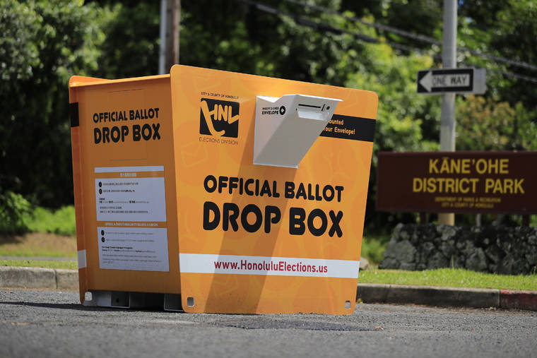 JAMM AQUINO / JAQUINO@STARADVERTISER.COM
                                A yellow ballot drop box is seen at Kaneohe District Park in Kaneohe.