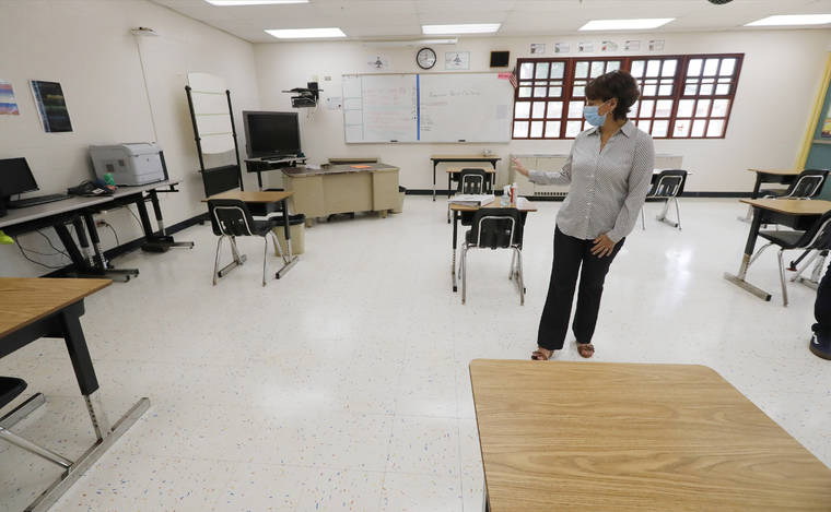 JAMM AQUINO / JAQUINO@STARADVERTISER.COM
                                DOE superintendent Christina Kishimoto stands inside one of the classrooms set up for social distancing at Kapolei Middle School on July 2.