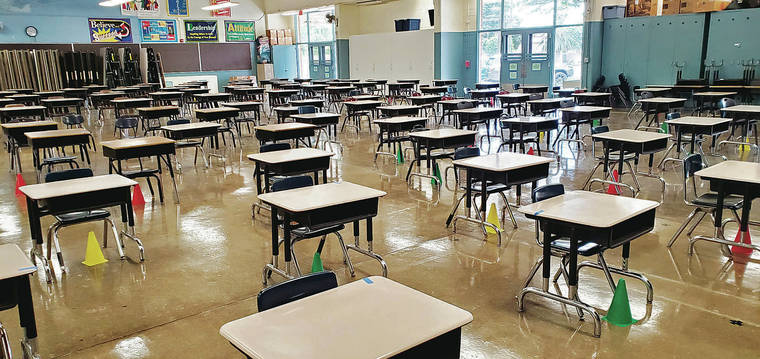 COURTESY CHERYL KUROIWA
                                Desks are arranged 6 feet apart so students can maintain social distancing while eating lunch in the cafeteria at Nimitz Elementary School once the school reopens.