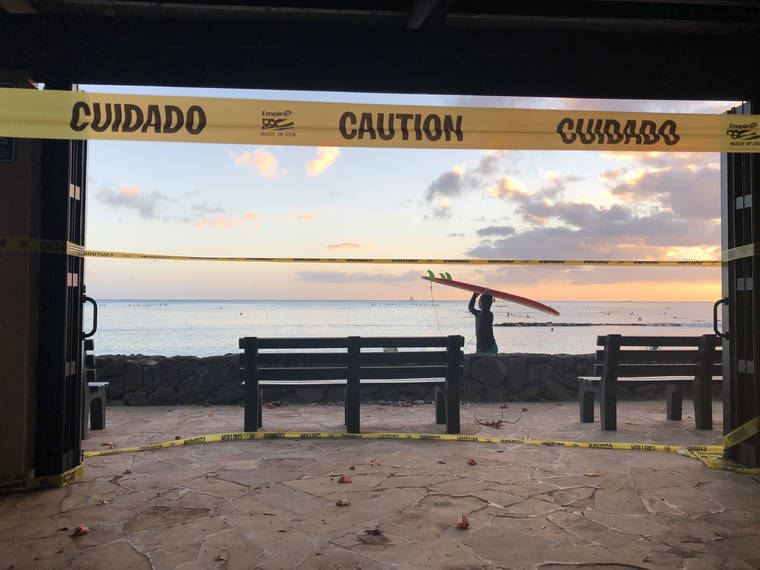 GEORGE F. LEE / AUG. 10
                                Public access to nearly all park amenities remained closed in Waikiki on Sunday due to coronavirus restrictions aimed at curbing the spread of the virus.