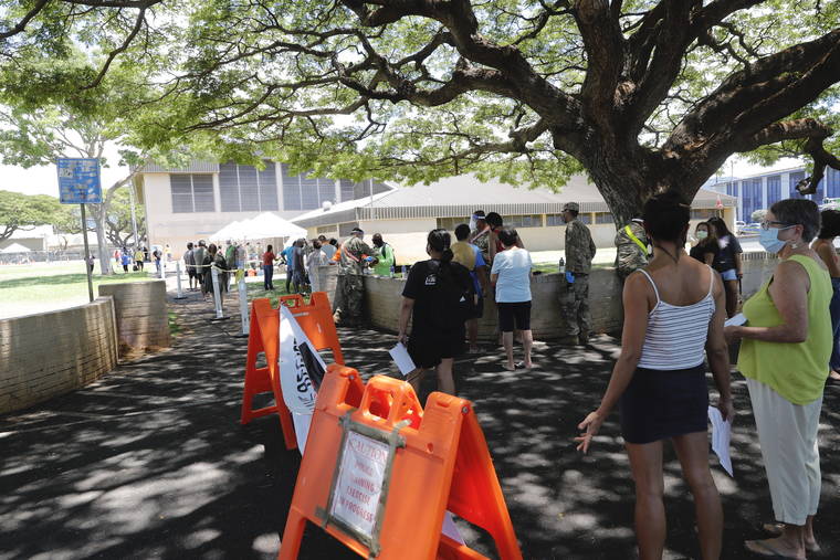 JAMM AQUINO / AUG. 27
                                People wait in line on the second day of surge COVID-19 testing on Thursday at Kalakaua District Park. U.S. Surgeon General Jerome Adams said the goal is to complete 60,000 tests by Sept. 8.