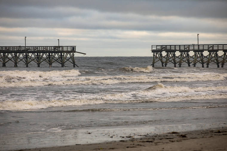 JASON LEE/THE SUN NEWS VIA ASSOCIATED PRESS
                                The private Sea Cabins pier was seen damaged following Hurricane Isaias, in North Myrtle Beach, S.C., today.