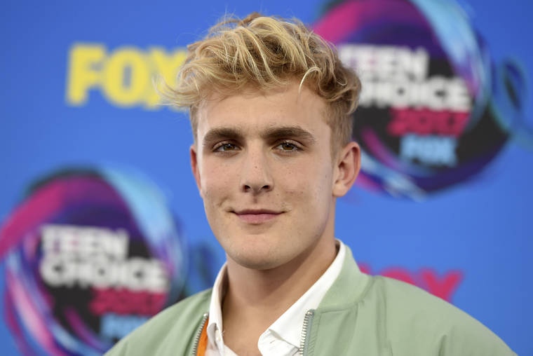 JORDAN STRAUSS/INVISION/ASSOCIATED PRESS
                                Internet personality Jake Paul arrived at the Teen Choice Awards in Los Angeles, in Aug. 2017. FBI agents including a SWAT team raided the home of YouTube star Jake Paul.