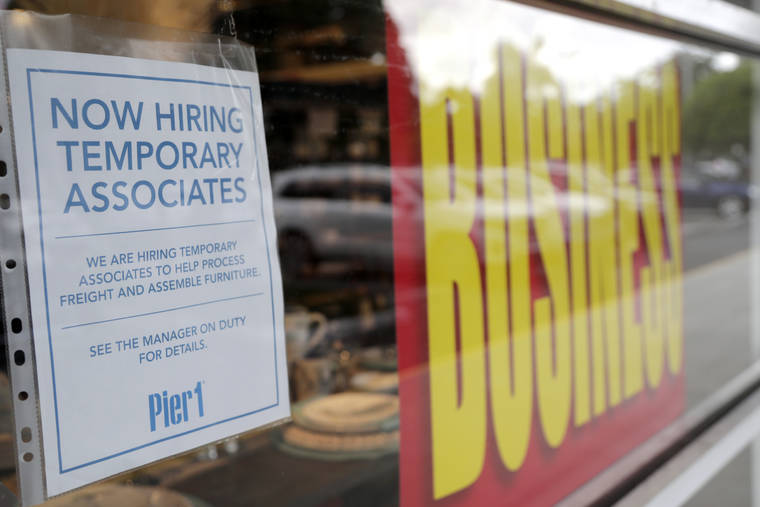 ASSOCIATED PRESS
                                A sign advertises hiring of temporary associates at a Pier 1 retail store, which is going out of business, during the coronavirus pandemic, Thursday, in Coral Gables, Fla.
