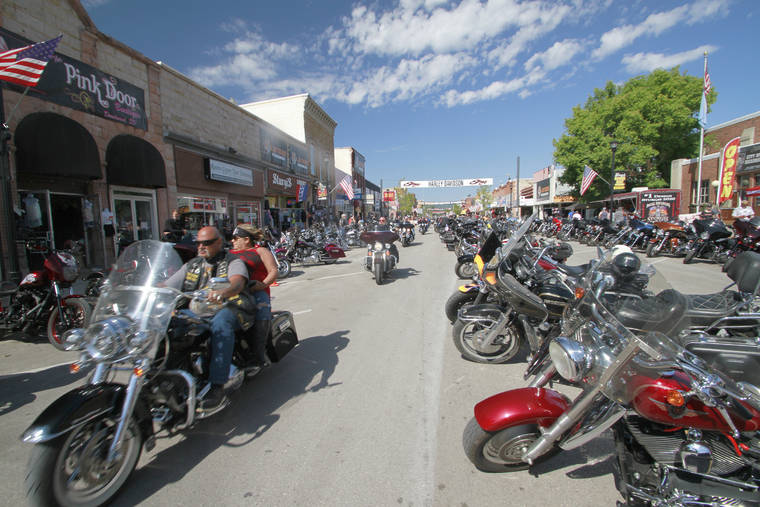 ASSOCIATED PRESS
                                Thousands of bikers rode through the streets for the opening day of the 80th annual Sturgis Motorcycle rally, today, in Sturgis, S.D.
