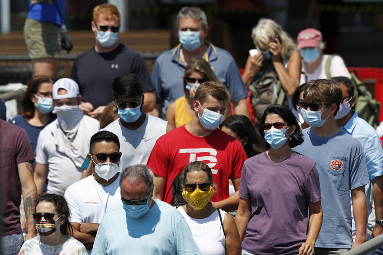 ASSOCIATED PRESS / July 30, 2020
                                Passengers board a Casco Bay Lines ferry bound for Peaks Island in Portland, Maine. America’s failure so far to contain the spread of the coronavirus as it moves across the country has been met with astonishment and alarm on both sides of the Atlantic.