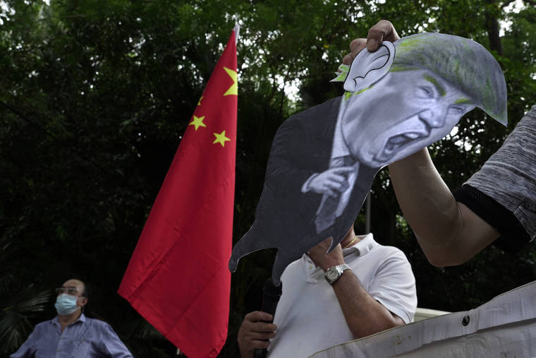 ASSOCIATED PRESS
                                Pro-China supporters displayed a picture of President Donald Trump during an Aug. 8 protest against the U.S. sanctions outside the U.S. Consulate in Hong Kong. China announced, Monday, unspecified sanctions against 11 U.S. politicians and heads of organizations promoting democratic causes, including Senators Marco Rubio and Ted Cruz, who have already been singled out by Beijing.