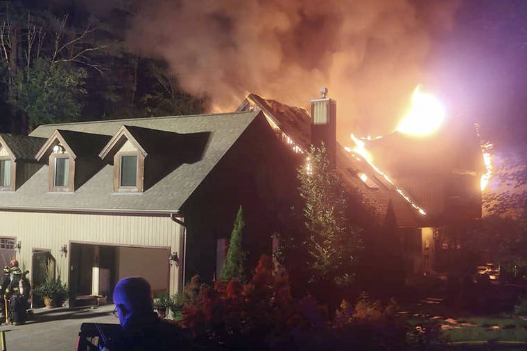 ASSOCIATED PRESS
                                A massive fire engulfs the home of cooking show star Rachael Ray, in Lake Luzerne, N.Y., on Sunday. Ray’s representative said in a statement that Ray, her husband and dog were safe, but that the extent of damage to the home was not yet clear.