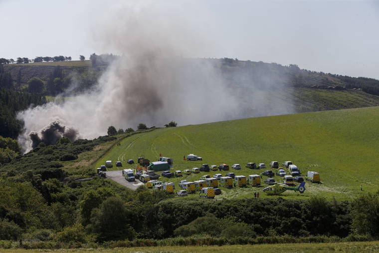 ROSS JOHNSTON/NEWSLINE-MEDIA VIA ASSOCIATED PRESS
                                Emergency services attended the scene of a derailed train in Stonehaven, Scotland, today. Police and paramedics responded today to a train derailment in northeast Scotland, where smoke could be seen rising from the site. The hilly area was hit by storms and flash flooding overnight.