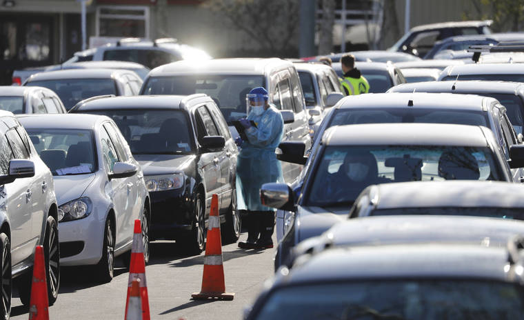 ASSOCIATED PRESS
                                Cars queue at a COVID-19 test centre in Auckland, New Zealand, on Thursday.