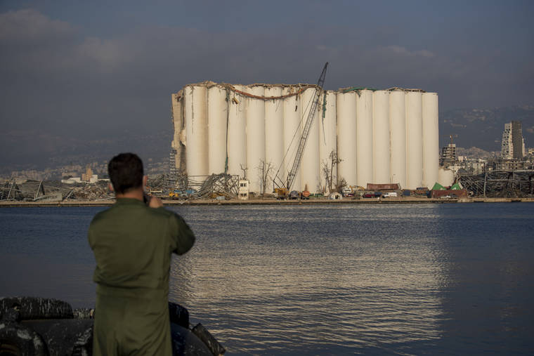 ASSOCIATEDP RESS
                                A Brazilian soldier takes a picture of a damaged silo that stands amid rubble and debris at the site of the Aug. 4 explosion that killed more than 170 people, injured thousands and caused widespread destruction in Beirut, Lebanon.