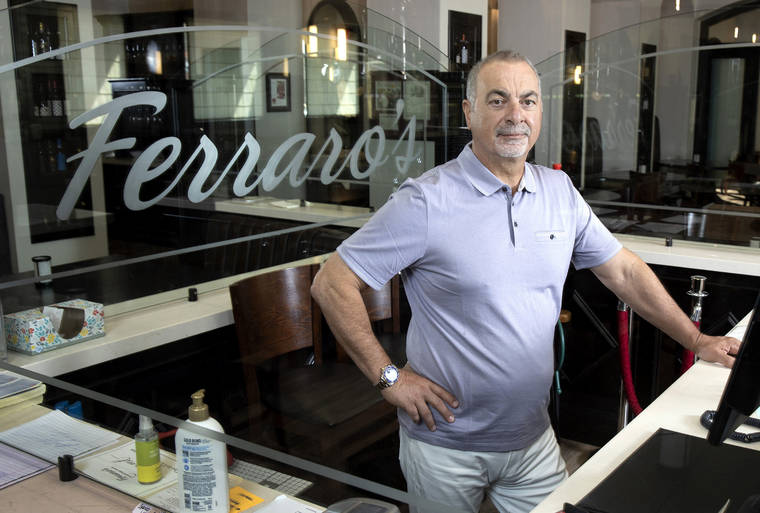 LAS VEGAS SUN VIA AP
                                Gino Ferraro poses for a picture at Ferraro’s Italian Restaurant & Wine Bar.