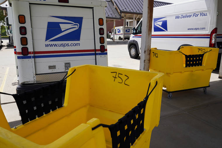 ASSOCIATED PRESS
                                Mail delivery vehicles were parked outside a post office in Boys Town, Neb., Tuesday. House Speaker Nancy Pelosi said today that President Donald Trump’s postmaster general has no intention of restoring mail equipment or funding overtime hours he cut