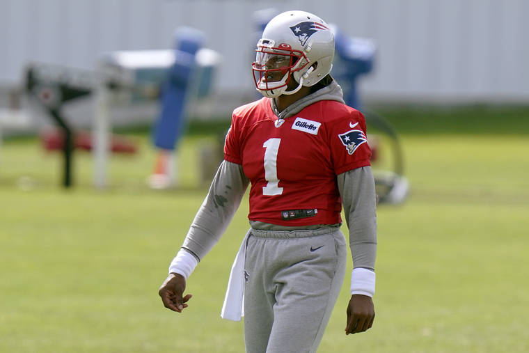 ASSOCIATED PRESS
                                New England Patriots quarterback Cam Newton walks on the field during an NFL football training camp practice today in Foxborough, Mass.