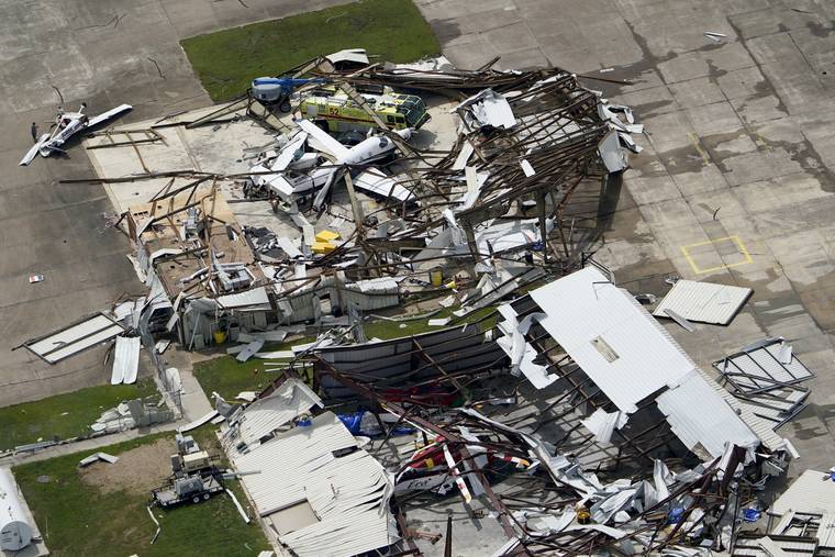 AP / AUG. 27
                                A airplane hangar is destroyed Aug. 27, after Hurricane Laura went through the area near Lake Charles, La.