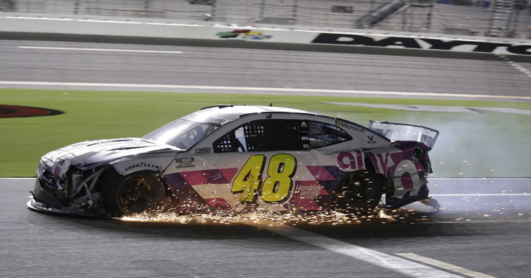 ASSOCIATED PRESS
                                Jimmie Johnson drives his damaged car on pit road during the NASCAR Cup Series auto race at Daytona International Speedway on Saturday in Daytona Beach, Fla.