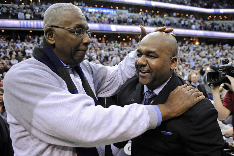 ASSOCIATED PRESS / MARCH 2013
                                Former Georgetown coach John Thompson Jr., left, congratulated his son Georgetown head coach John Thompson III, right, after the Hoya’s 61-39 win over Syracuse in an NCAA college basketball game in Washington. Thompson, the imposing Hall of Famer who turned Georgetown into a “Hoya Paranoia” powerhouse and became the first Black coach to lead a team to the NCAA men’s basketball championship, has died.