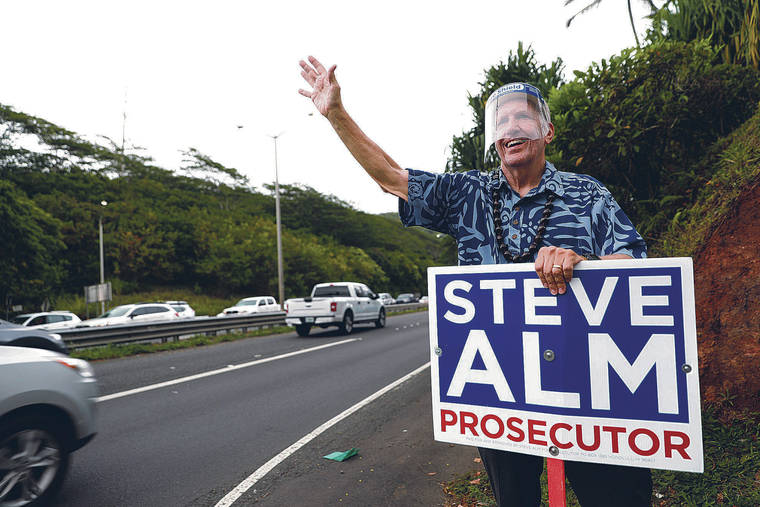 JAMM AQUINO / JAQUINO@STARADVERTISER.COM
                                Judge Steve Alm, nonpartisan candidate for Honolulu prosecutor, waved to drivers Friday in Kailua.