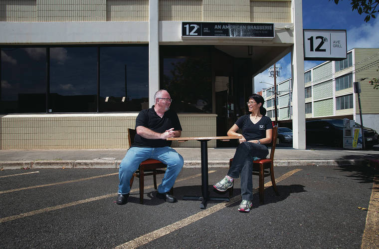 CINDY ELLEN RUSSELL / JUNE 4
                                12th Ave Grill owners Kevin Hanney and Denise Luke turned an adjacent parking area into outdoor seating. They hope to use the space for pop-up events now that they’ve closed the restaurant.