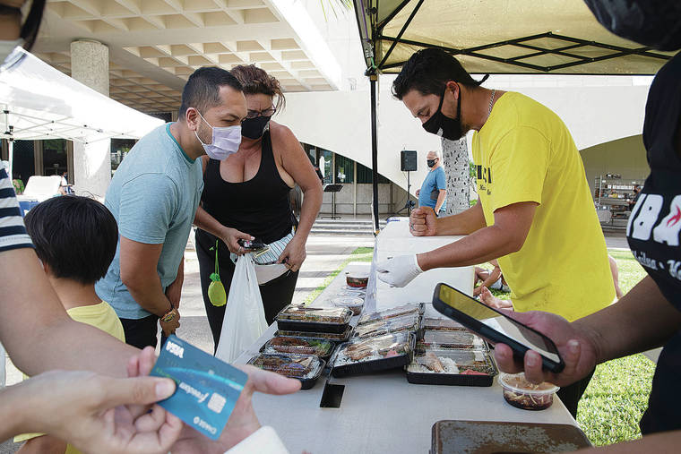 GEORGE F. LEE / GLEE@STARADVERTISER.COM
                                Vincent Verdeprado, left and Joele Alameida looked over there bento offerings with Christopher Merez of The Hibachi located in Kailua during the Farmers Market at the Blaisdell Center on Wednesday Aug. 12.