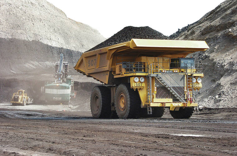 ASSOCIATED PRESS / 2013
                                A truck carrying 250 tons of coal hauls its load to the surface of the Spring Creek mine near Decker, Mont.