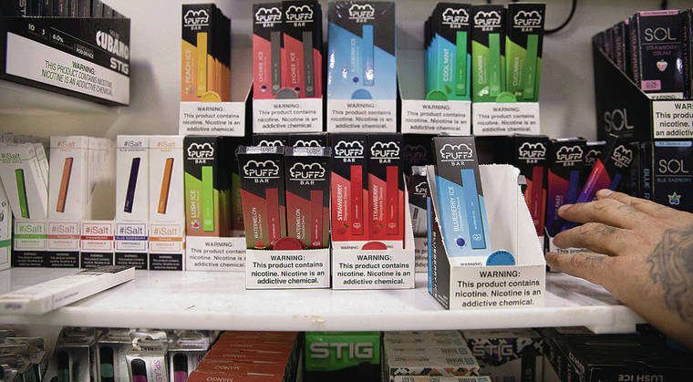 ASSOCIATED PRESS
                                A variety of brands and flavors of disposable vape devices at a store in New York.