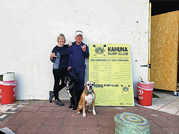 Kailua residents Terry and Terry Korpi found the Kahuna Surf Club and a couple of friendly pups while on a trip to Haifa, Israel, in February. Photo by the shop owner.
