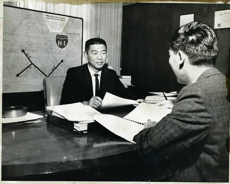 STAR-ADVERTISER / 1963
                                Before Fujio Matsuda, left, became the first Asian American to head a major university, he was appointed director of the Department of Transportation. Above, Matsuda and Munny Lee, then the department’s program officer, confer on future highway projects. Matsuda died Aug. 23 at home. He was 95.