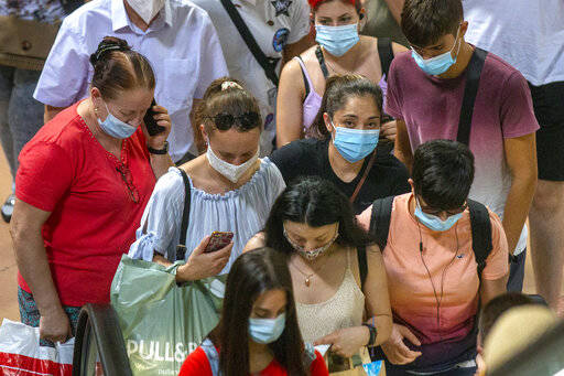 ASSOCIATED PRESS
                                People crowd the commuter train platforms at Atocha station in Madrid, Spain on Thursday. Authorities in Madrid, the hottest spot in Spain’s new surge of coronavirus contagion, said last week that they only consider very localized stay-at-home orders for the worst-hit areas of the Spanish capital, discarding the idea locking down the city of 3.3 million.