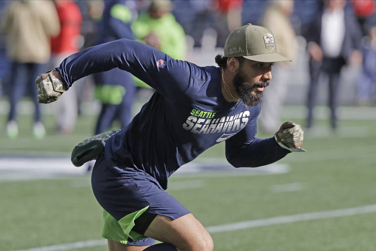 ASSOCIATED PRESS
                                Seattle Seahawks wide receiver John Ursua ran on the field, in Nov. 2019, during warmups before a game against the Seattle Seahawks, in Seattle. Ursua was back practicing with the Seattle Seahawks today after it was determined he had received a false-positive result on a coronavirus test administered this past Saturday.