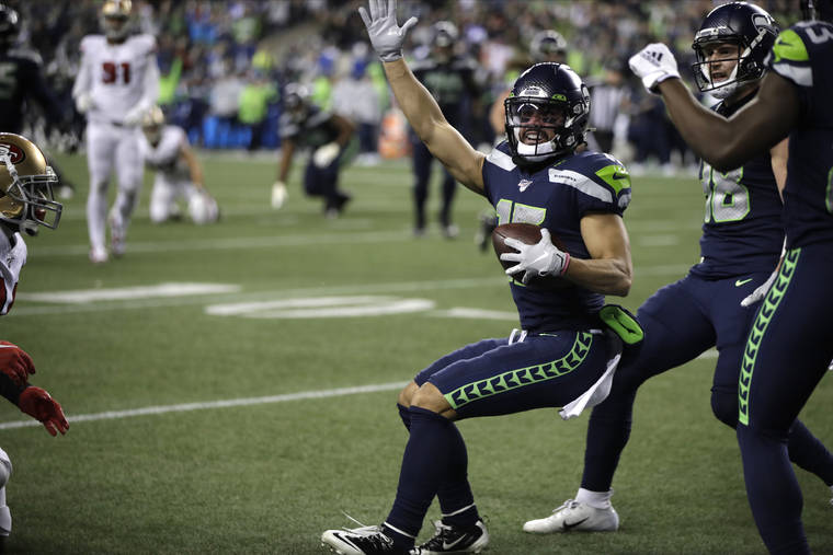 Seattle Seahawks’ John Ursua motions after a play against the San Francisco 49ers during the second half of an NFL football game, Sunday, Dec. 29, 2019, in Seattle. (AP Photo/Stephen Brashear)