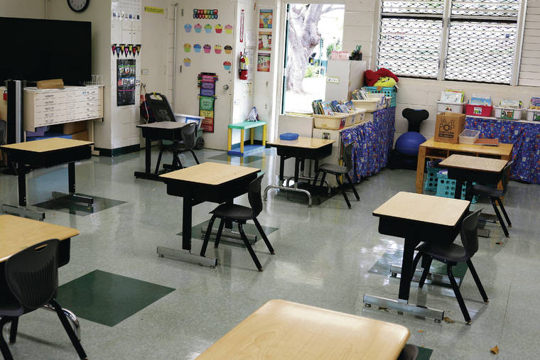 ASSOCIATED PRESS / JULY 28
                                Officials will assess whether or not students can return to in-person blended learning models on Sept. 14 in the third phase of the public school plan announced Friday. Above, desks are spaced out in a classroom at Aikahi Elementary School in Kailua last month.