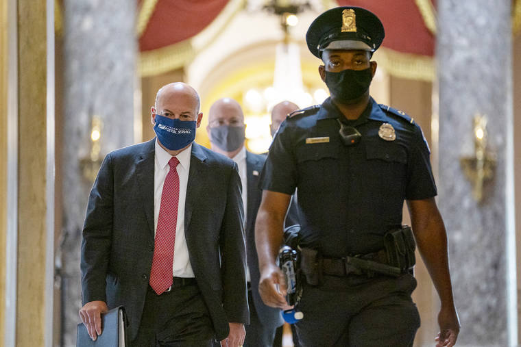 ASSOCIATED PRESS
                                Postmaster General Louis DeJoy, left, is escorted to House Speaker Nancy Pelosi’s office on Capitol Hill in Washington on Aug. 5.