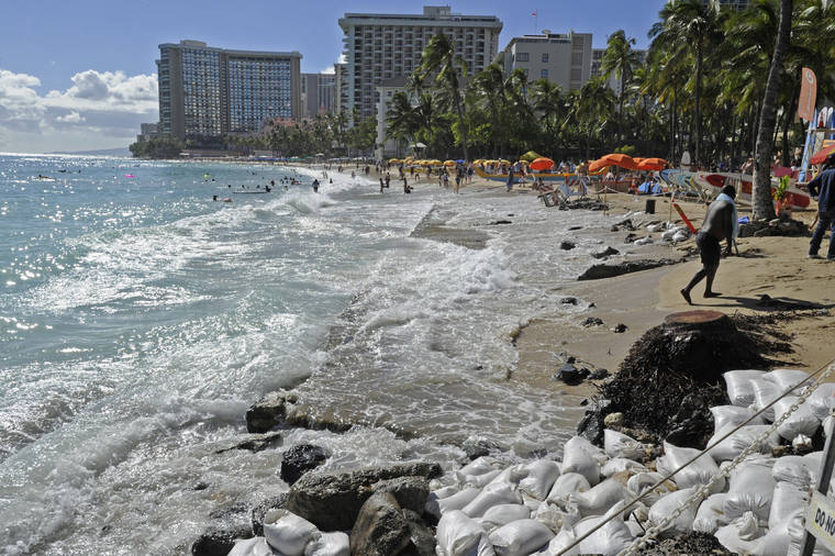 STAR-ADVERTISER / JUNE 2017
                                The National Weather Service says a combination of high tides and abnormally high sea levels will produce nuisance coastal flooding over the next couple of days. Here, so-called king tides hit Waikiki Beach in 2017.