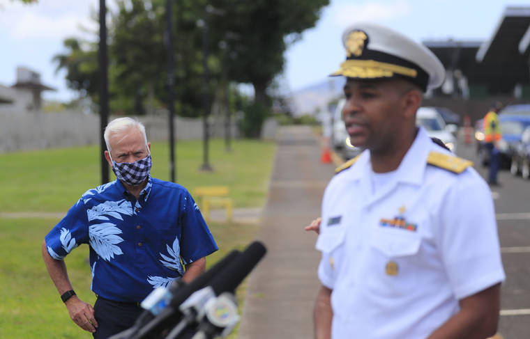 JAMM AQUINO / JAQUINO@STARADVERTISER.COM
                                U.S. Surgeon General Jerome Adams speaks as Honolulu Mayor Kirk Caldwell, left, listens during a news conference on the first day of COVID-19 surge testing put on by the city on Wednesday at Leeward Community College in Pearl City.