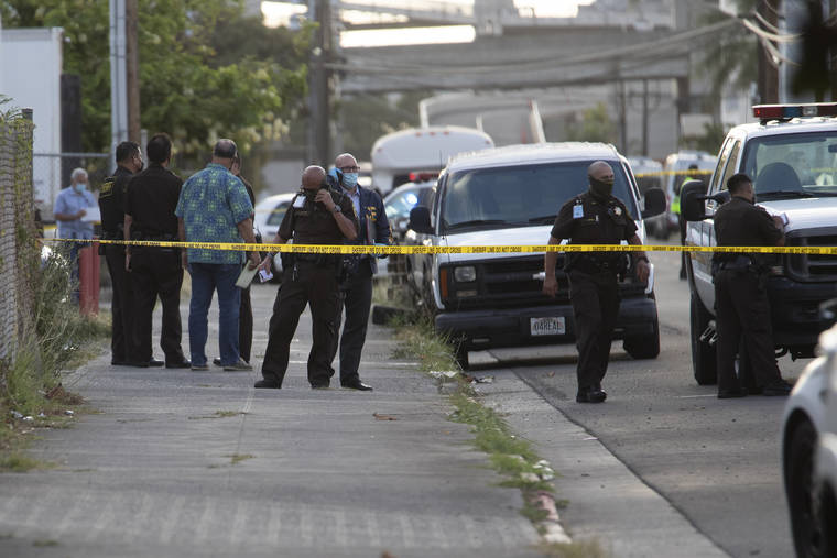 GEORGE F. LEE / GLEE@STARADVERTISER.COM
                                Department of Public Safety Officers were on the scene near 3069 Ualena Street Wednesday afternoon following a shooting.