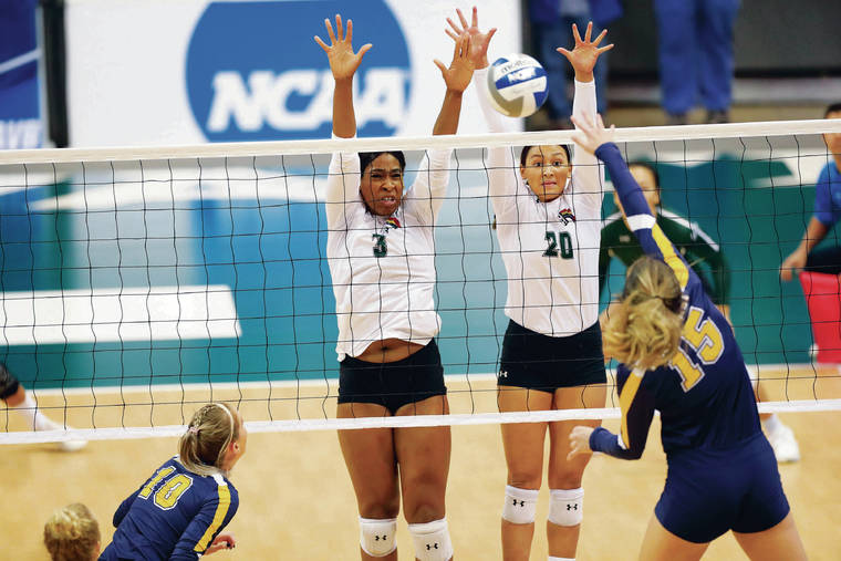 MARCO GARCIA / SPECIAL TO THE STAR-ADVERTISER / DEC. 2019
                                Hawaii’s Amber Igiede, left, and McKenna Ross went up for a block against Northern Colorado in an NCAA women’s volleyball tournament first-round match on Dec. 6 at the Stan Sheriff Center. UH has played in the tournament in each of the last 27 years.
