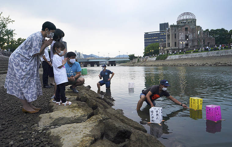 ASSOCIATED PRESS
                                <strong>HIROSHIMA REMEMBERED:</strong> Events held around the world last week marked the 75th anniversary of the bombing of Hiroshima during World War II. Although Japan’s public lantern event was canceled due to the pandemic, a few local representatives released lanterns along the Motoyasu River, above, near the Atomic Bomb Dome in Hiroshima.