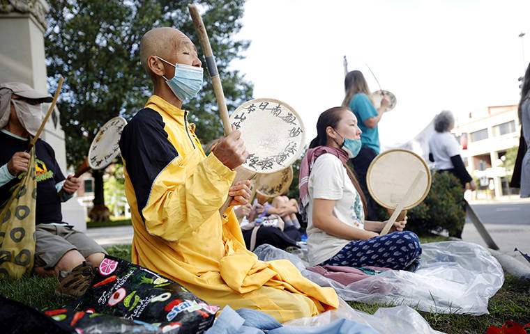 BERKSHIRE EAGLE VIA AP
                                Jun Yasuda led a Buddhist chant during a vigil at Park Square in Pittsfield, Mass.