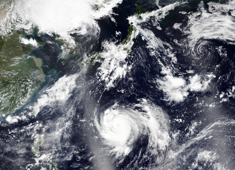 NASA VIA ASSOCIATED PRESS
                                A satellite image released by NASA Worldview Earth Observing System Data and Information System (EOSDIS), Thursday, shows tropical storm Haishen, lower center, sweeping northward.