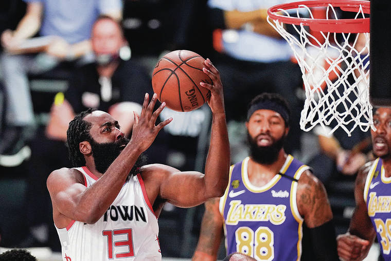 ASSOCIATED PRESS
                                Houston’s James Harden drove to the basket ahead of Los Angeles’ Markieff Morris during Game 1 of a Western Conference semifinal series on Friday.