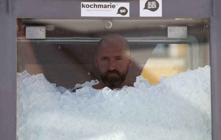 ASSOCIATED PRESS / SEPT. 5
                                Austrian ice swimmer Josef Koeberl is standing in a glass cabin filled with ice try to break the world record for a human to stay side an ice box in Melk.