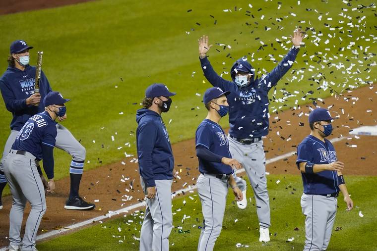 ASSOCIATED PRESS
                                Tampa Bay Rays’ Yoshitomo Tsutsugo, right, of Japan, celebrates with teammates after a baseball game against the New York Mets today in New York. The Rays won 8-5.