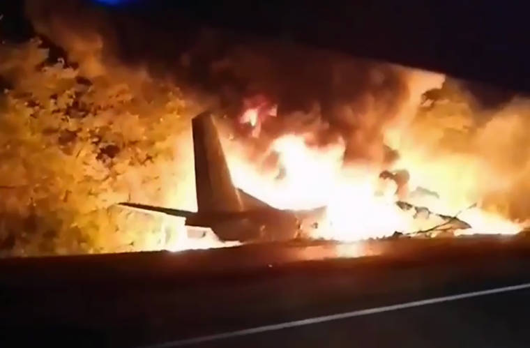 COURTESY UKRAINE’S EMERGENCY SITUATION MINISTRY
                                In this TV grab, an AN-26 military plane bursts into flames after it crashed in the town of Chuguyiv close to Kharkiv, Ukraine.