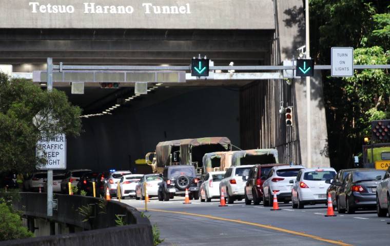 COURTESY HAWAII COVID-19 JOINT INFORMATION CENTER
                                Vehicles lined up at the entrance to Tetsuo Harano Tunnel on H-3, today, for people to get surge testing.