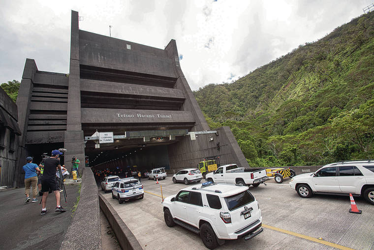 CINDY ELLEN RUSSELL / CRUSSELL@STARADVERTISER.COM
                                H-3 was closed for COVID-19 surge testing. Above, the Kaneohe bound Tetsuo Harano Tunnel where drive thru testing occurred inside. Each tunnel had 50 testing stations and 30 registrations stations inside.