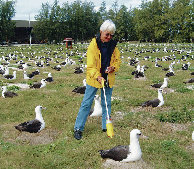 COURTESY U.S. FISH AND WILDLIFE SERVICE
                                Laura Thompson counted albatross on Midway Atoll National Wildlife Refuge during the annual census in 2005.