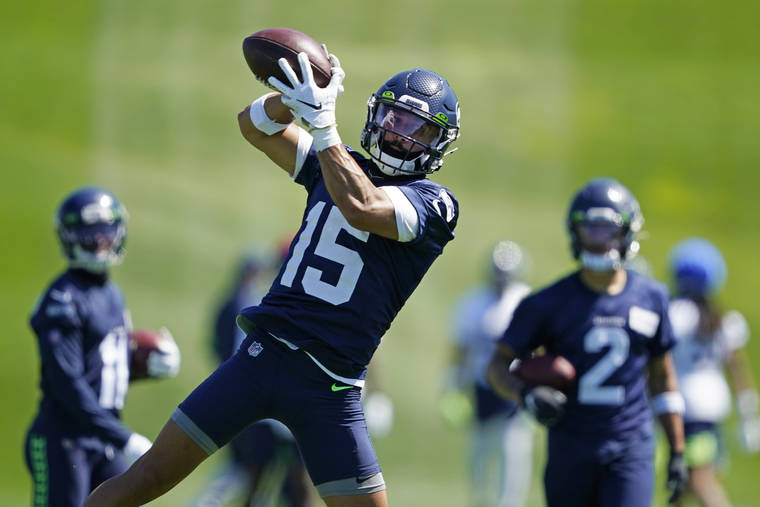 ASSOCIATED PRESS
                                Seattle Seahawks wide receiver John Ursua makes a catch during NFL football training camp on Aug. 14 in Renton, Wash.